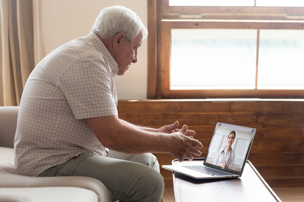 An older adult receives telehealth services