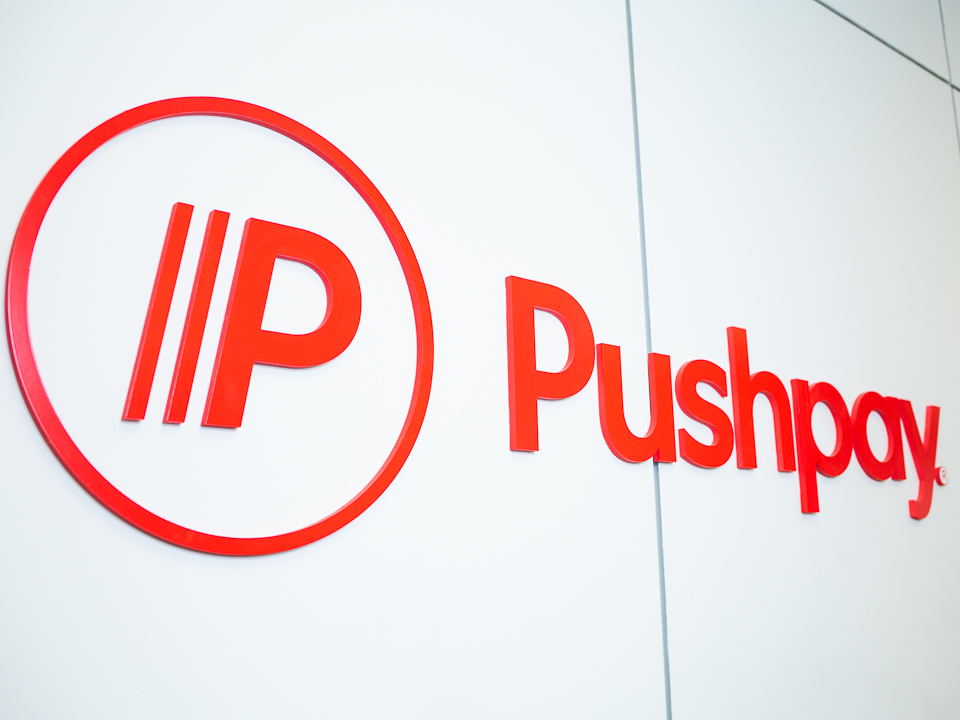 Photo of the Pushpay logo in its office