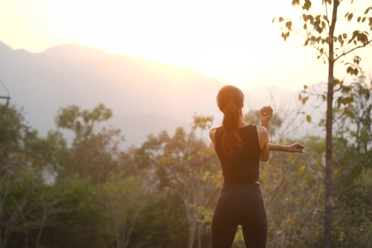 Woman stretching in the park before running