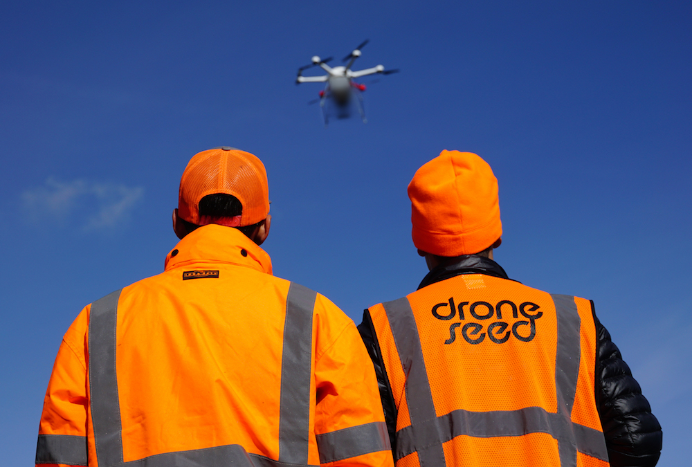 Drone operators controlling a DroneSeed drone.