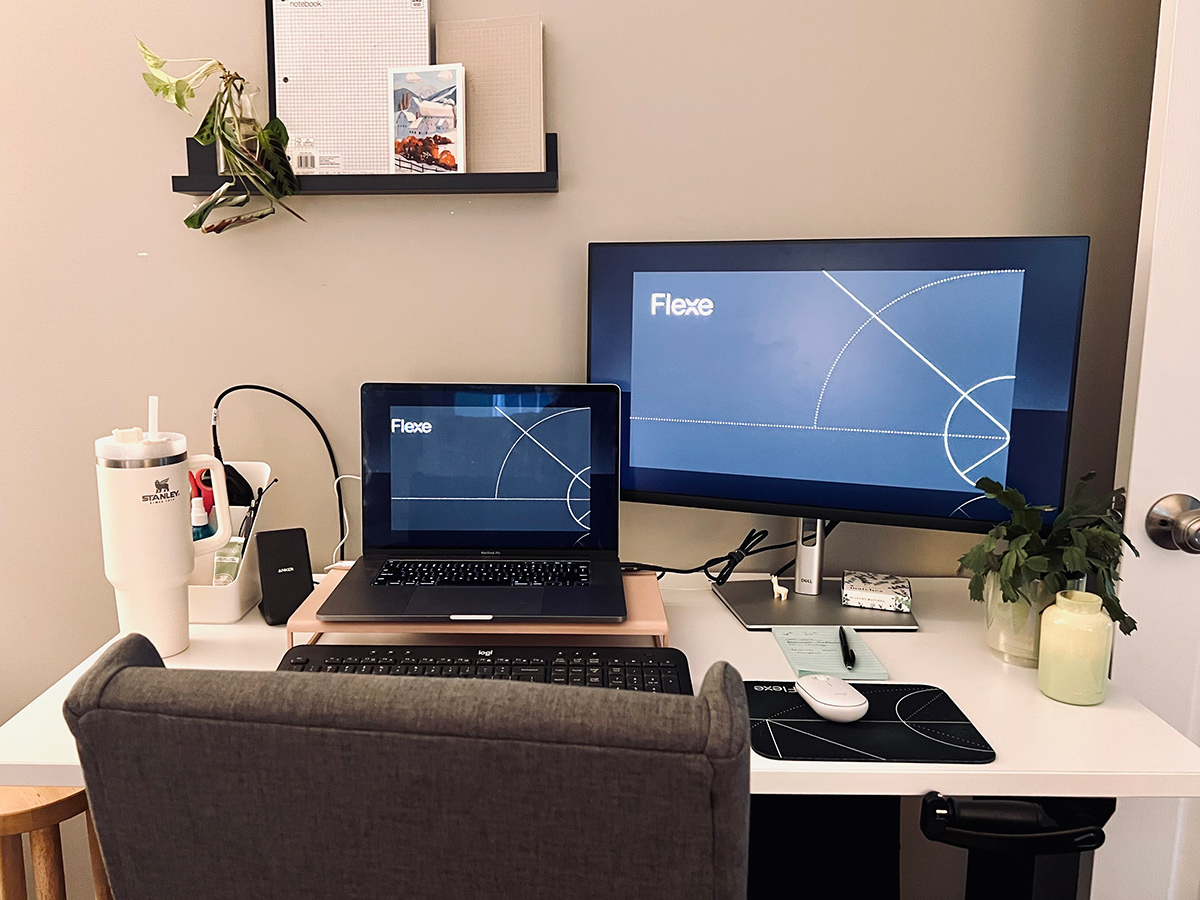 Flexe team members desk with a laptop and monitor