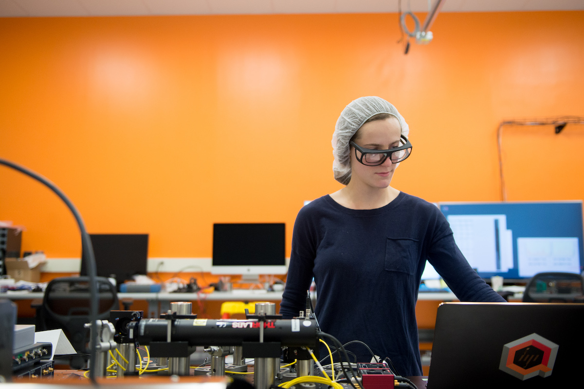 A woman scientist works at a table