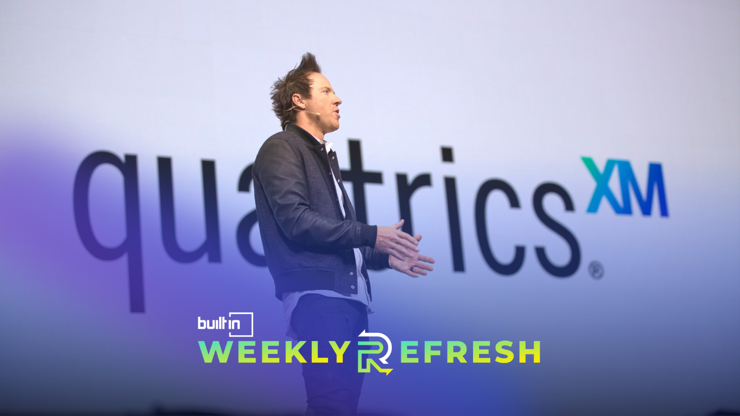Qualtrics founder and executive chairman Ryan Smith speaking at an event.