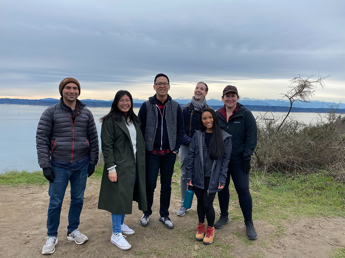 Symbl.ai team members outside with a lake behind them