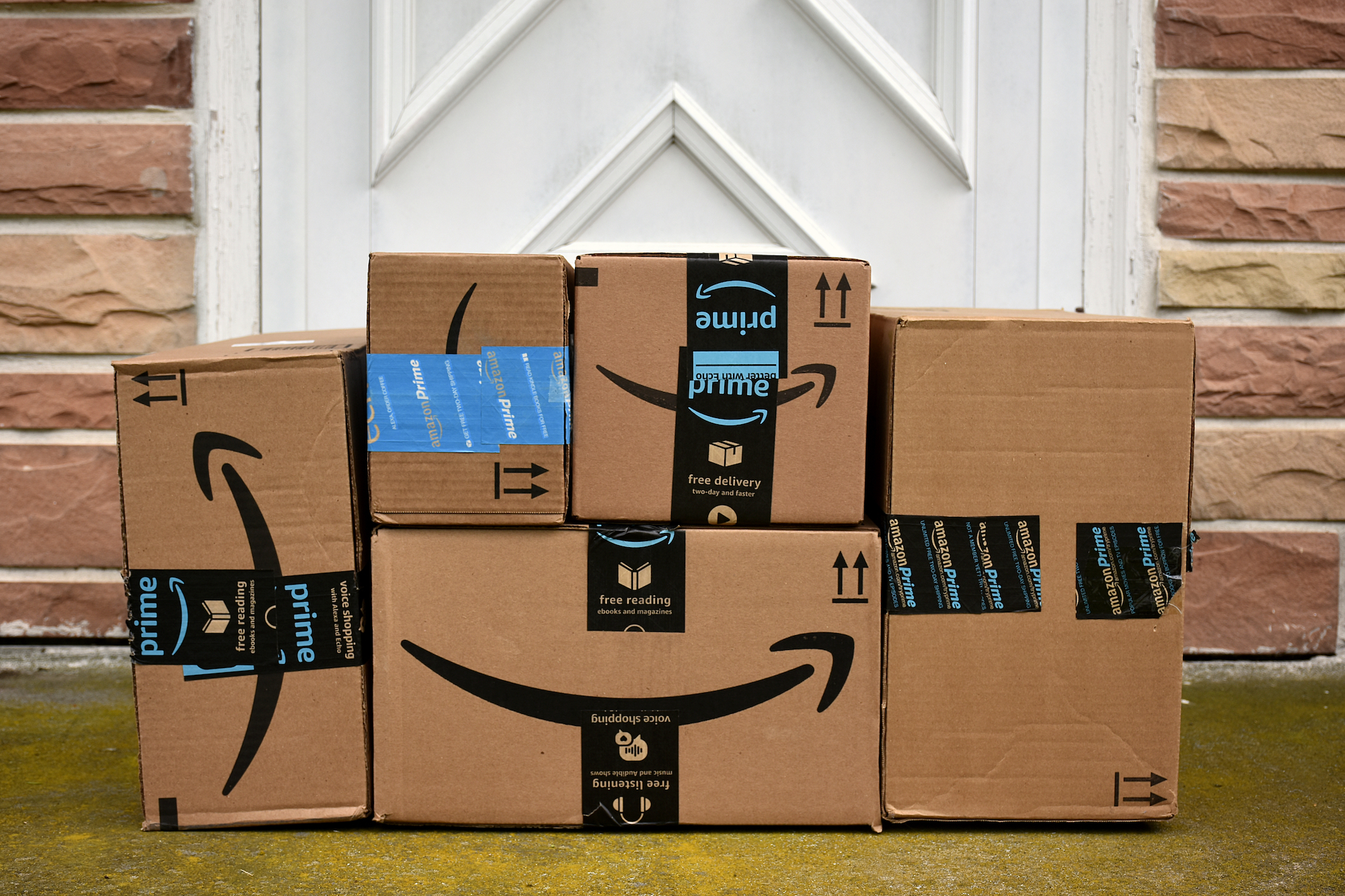 A stack of Amazon boxes is pictured.