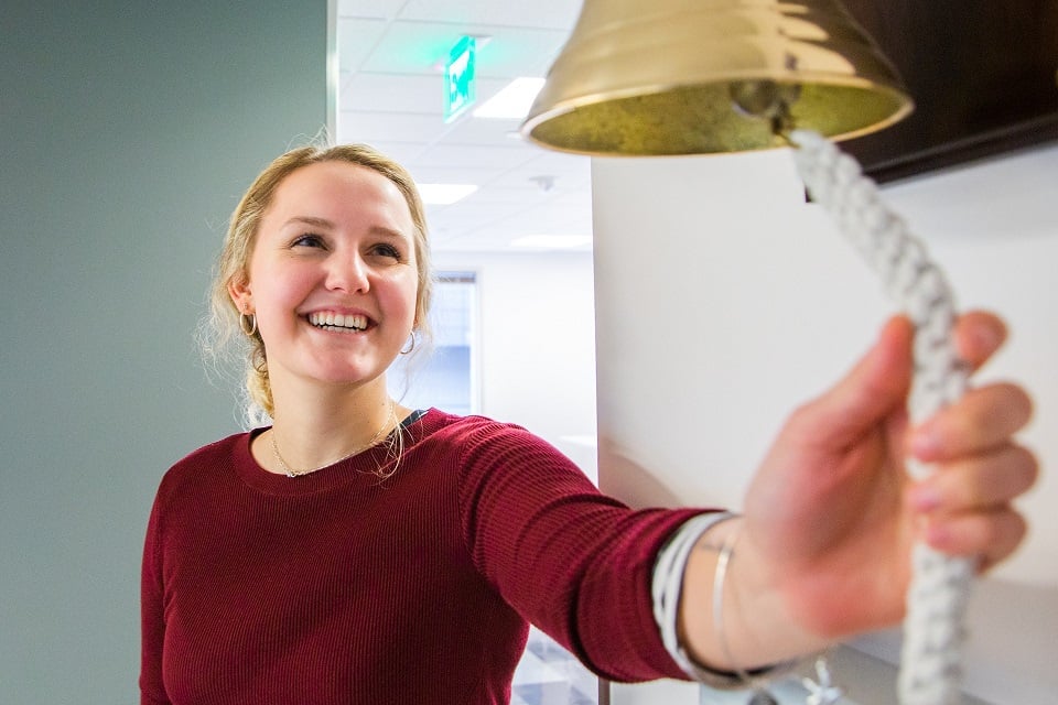 smartsheet bellevue employee ringing the bell