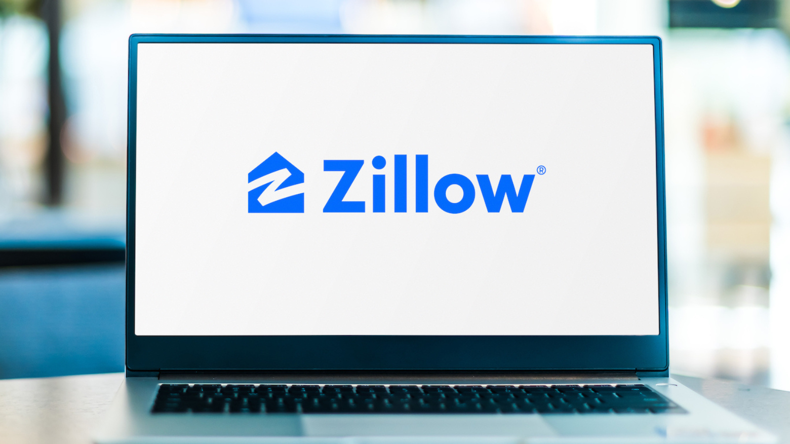 The Zillow logo on an open laptop.
