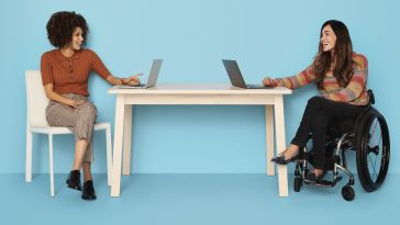 two women working at a table