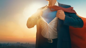 Superman revealing his true identity under his everyday clothing.