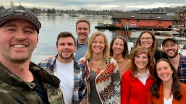 Tagboard team selfie outside with a lake in the background