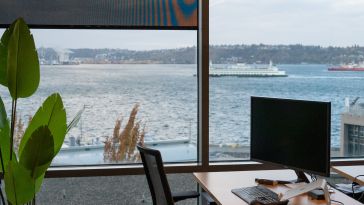 A desk in the TaxBit office looks out at the water in Seattle.
