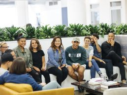 Photo of Foursquare employees gathered on a couch.